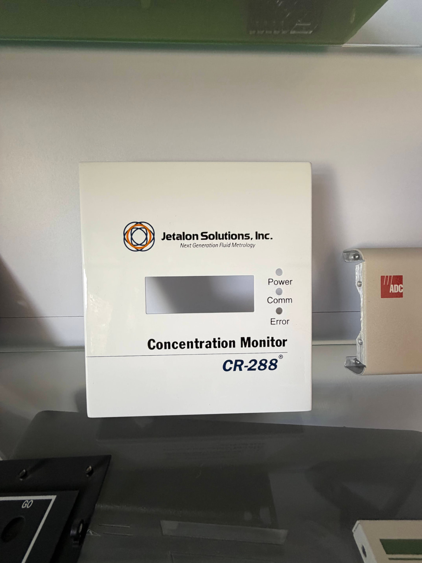 Finished technical equipment panel with branding and functional labeling
